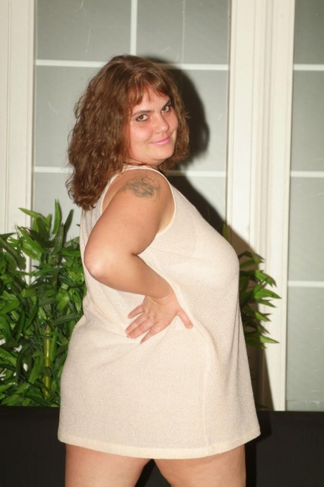 Fat woman takes a cumshot on her big boobs after sex in a kitchen