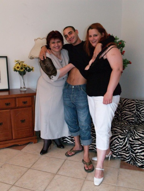 Obese women have a threesome with a skinny young man on a sofa