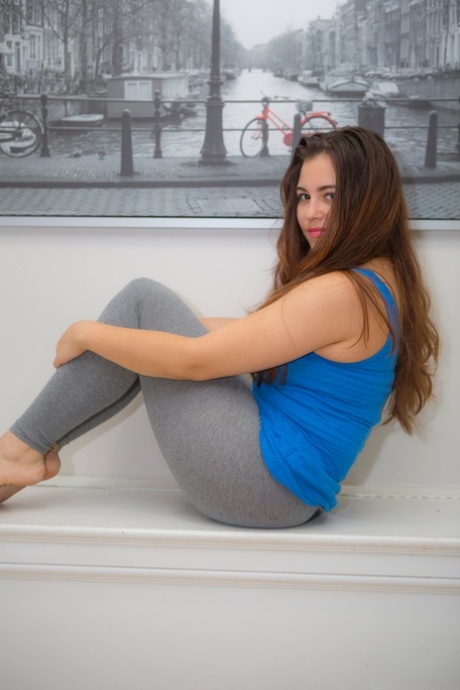 Sexy plump brunette Rachel does a slow striptease to reveal her pudgy ass