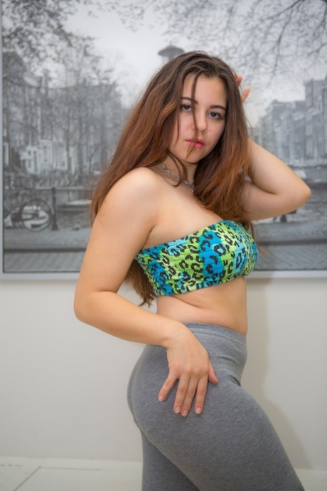 Sexy plump brunette Rachel does a slow striptease to reveal her pudgy ass