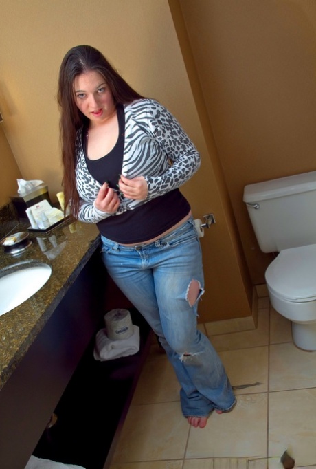 Horny Gemma in jeans gets naked in the bathroom to show her hot BBW body