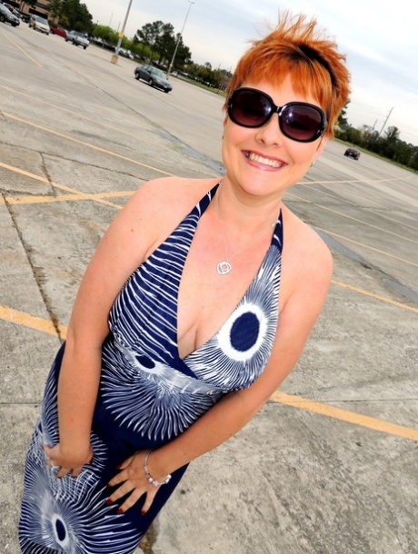 Redheaded amateur Kali Devine uncovers her natural tits before giving a BJ