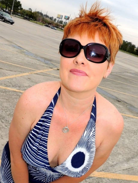 Redheaded amateur Kali Devine uncovers her natural tits before giving a BJ