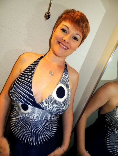 Redheaded amateur Kali Devine uncovers her natural tits before giving a BJ