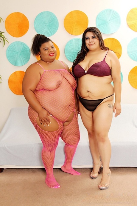 Obese lesbians Peaches Love and Bella Bangs lick and toy twats on a bed