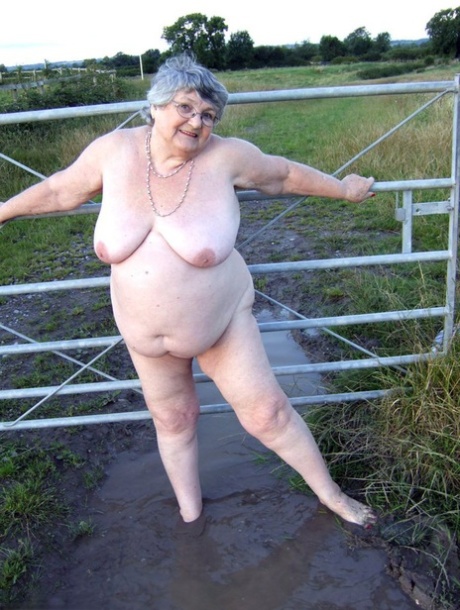 Fat nan Grandma Libby steps into a puddle before covering herself in mud