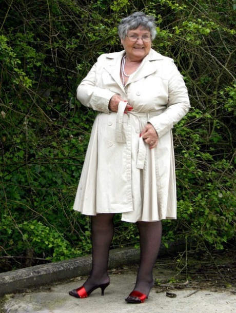 Fat nan Grandma Libby flashes by the trees in an overcoat before masturbating