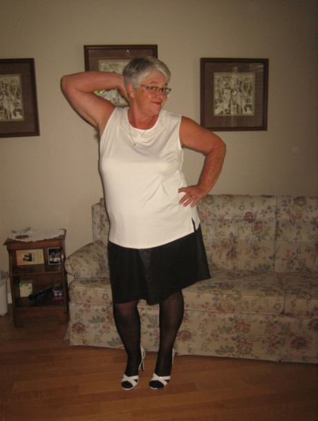 Fat old woman Girdle Goddess slips underwear over her big ass in nylons