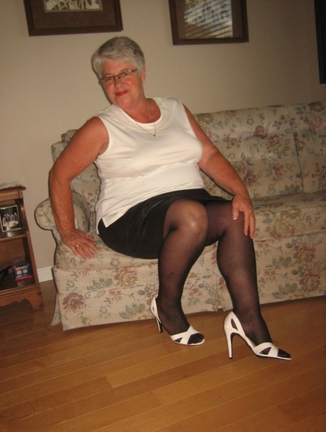 Fat old woman Girdle Goddess slips underwear over her big ass in nylons