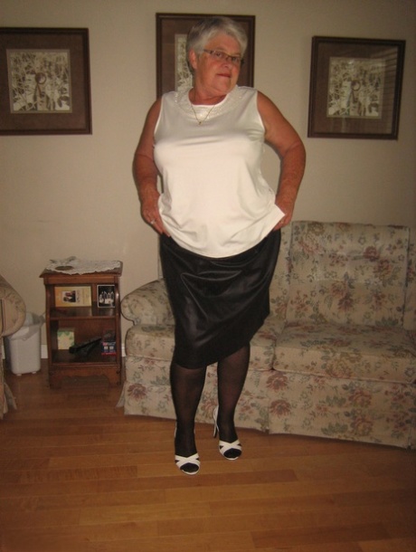 Fat old woman Girdle Goddess slips underwear over her big ass in nylons