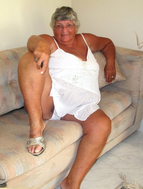 Fat lady Grandma Libby bares her saggy tits and big ass while on a couch