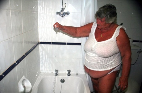 Obese old woman Grandma Libby gets completely naked while having a bath