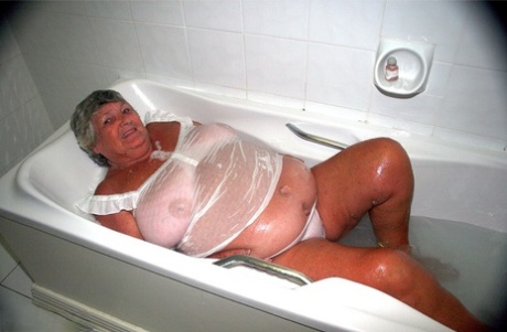 Obese old woman Grandma Libby gets completely naked while having a bath