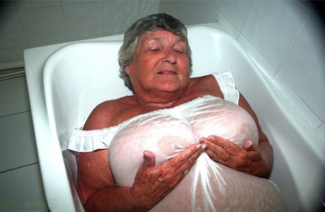Obese old woman Grandma Libby gets completely naked while having a bath