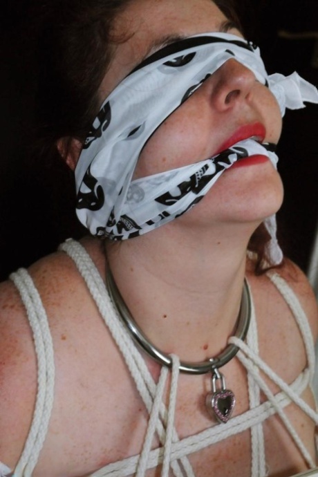 Fat female with red lisp is left gagged and tied up by ropes