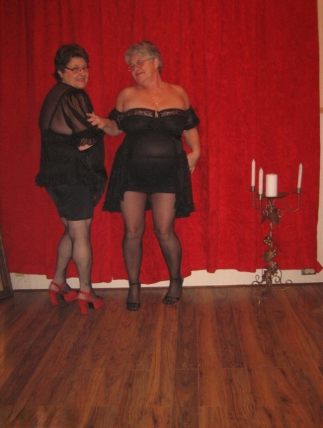 Big titted granny Girdle Goddess and her lesbian girlfriend don strapon cocks