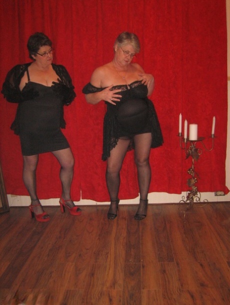 Big titted granny Girdle Goddess and her lesbian girlfriend don strapon cocks