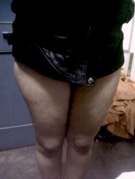 Fat Indian woman hides her face while adorned in a bra and thong