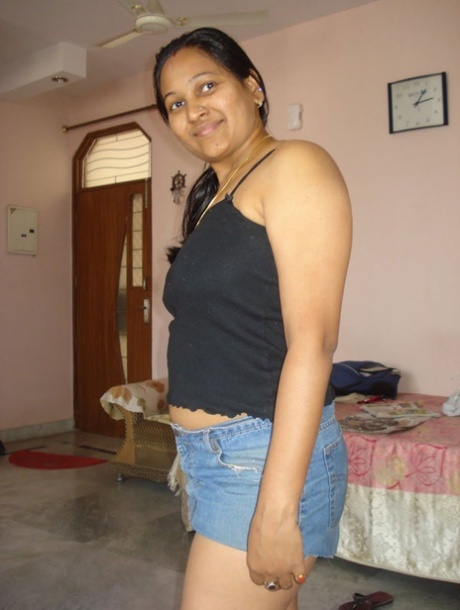 Indian plumper exposes upskirt underwear after freeing her boobs from a bra