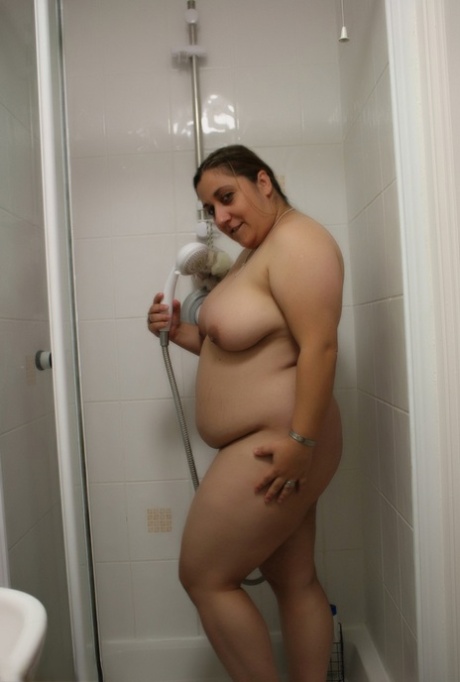 Amateur BBW Kimberly Scott sucks a suction dildo while taking a shower