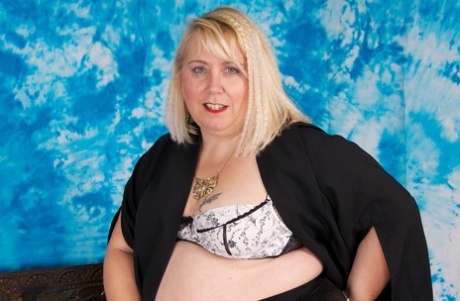British fatty Lexie Cummings finger spreads her pierced pussy in stockings