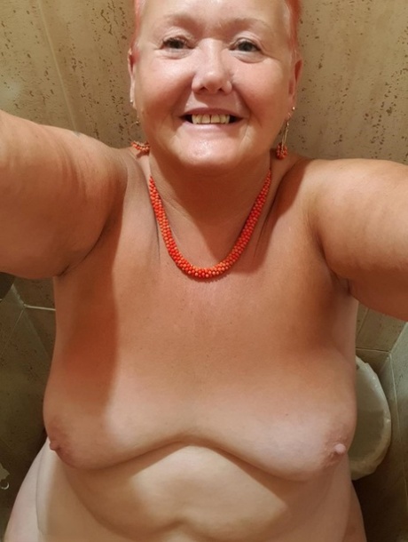 Fat granny with red hair Valgasmic Exposed takes naked selfies at home