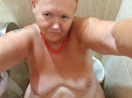 Fat granny with red hair Valgasmic Exposed takes naked selfies at home