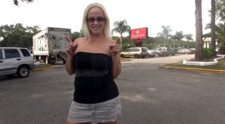 Blonde chick Dee Siren flashes her big tits in public before interracial sex
