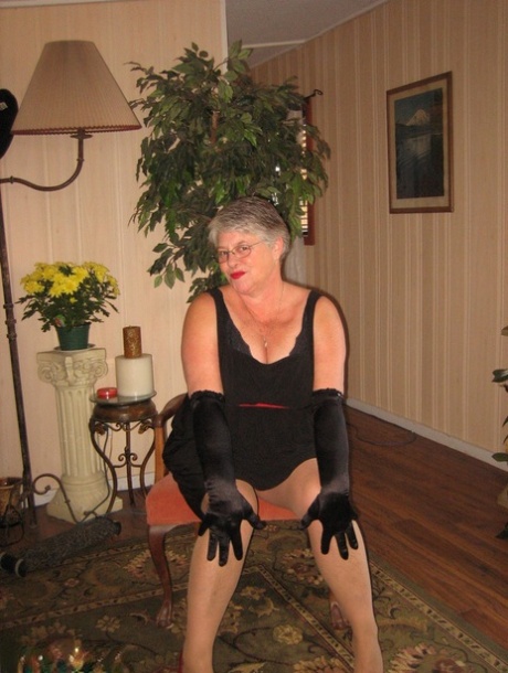 Old fatty Girdle Goddess fondles saggy tits in black velvet gloves and hose