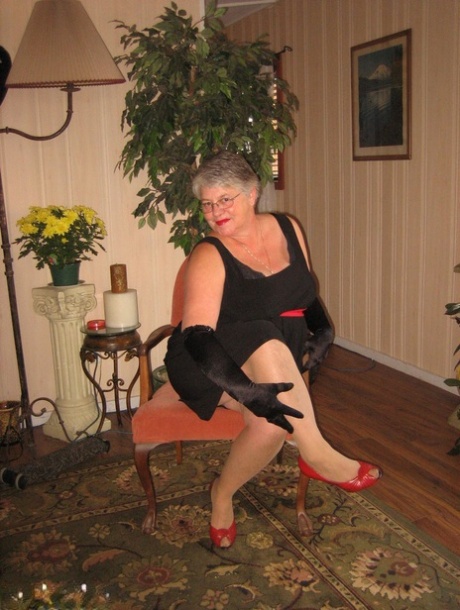 Old fatty Girdle Goddess fondles saggy tits in black velvet gloves and hose