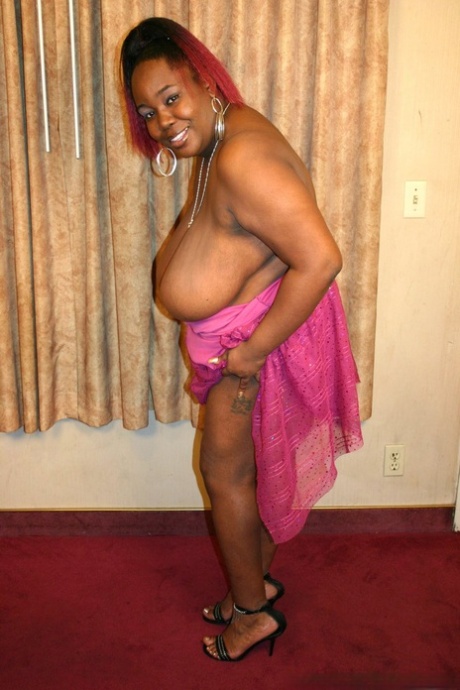 Big black girl takes a cumshot on her big boobs to conclude a fuck
