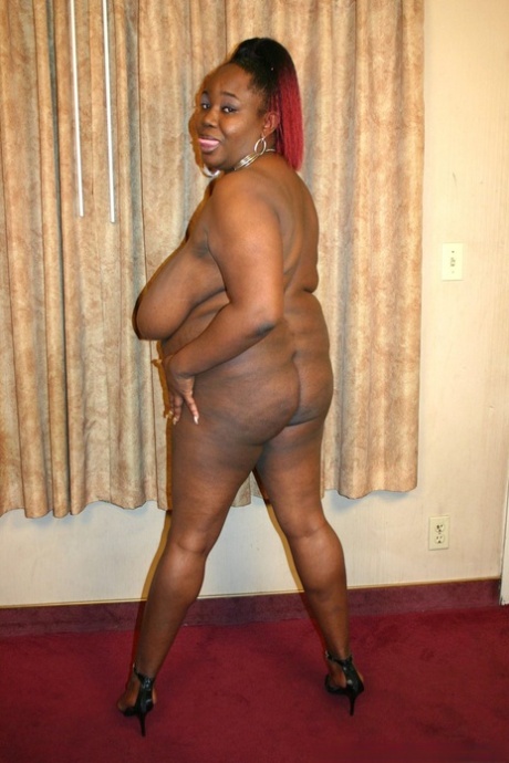 Big black girl takes a cumshot on her big boobs to conclude a fuck
