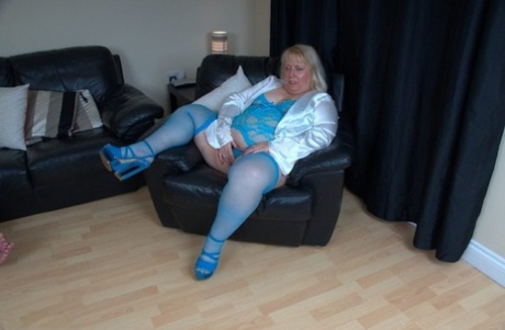 Obese mature woman Lexie Cummings shows her pierced pussy and huge ass at once