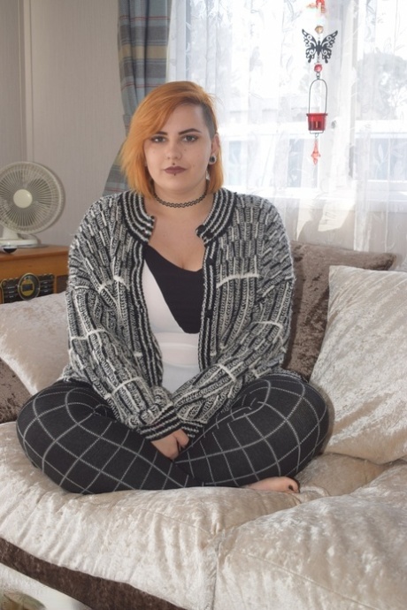 Fat redhead Phillipas Ladies stands naked after disrobing on a couch