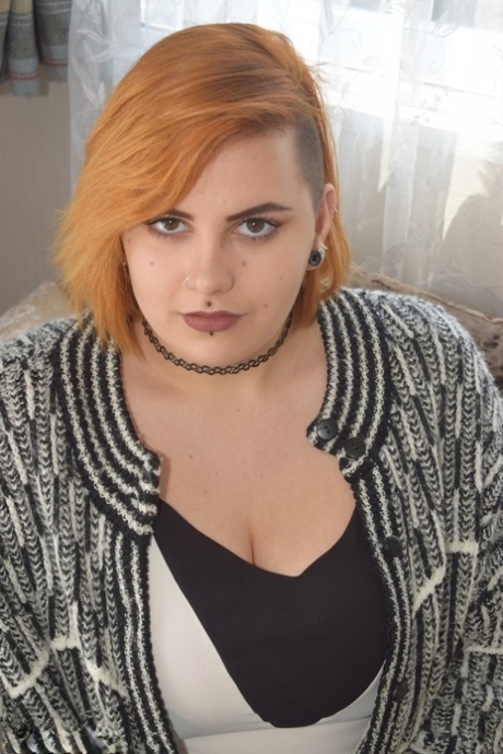 Fat redhead Phillipas Ladies stands naked after disrobing on a couch