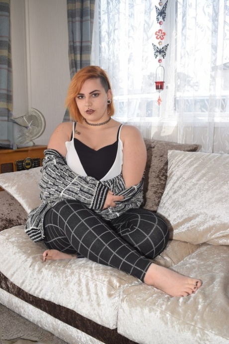 Fat redhead Phillipas Ladies stands naked after disrobing on a couch