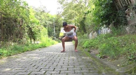 Distressed girl Chloe Lamour takes a piss on a cobblestone walkway