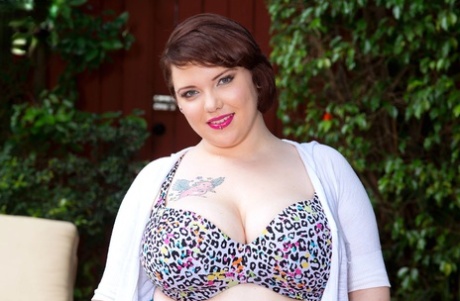 Obese female Kitty Mcpherson goes topless before slipping panties over her ass
