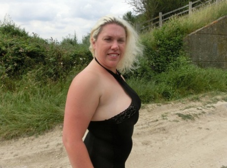 Blonde amateur Barby exposes her overweight body in a rural location