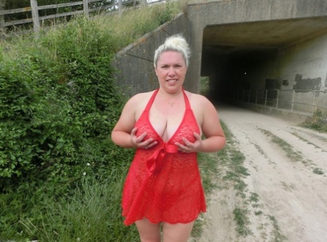Blonde amateur Barby exposes her overweight body in a rural location