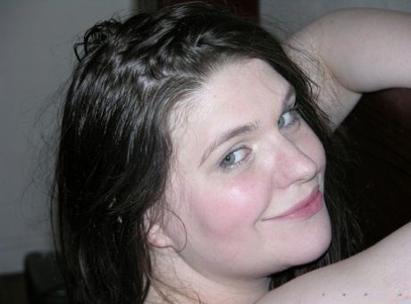 Brunette BBW Eliza Eliza holds her big ass while showing her naked pussy