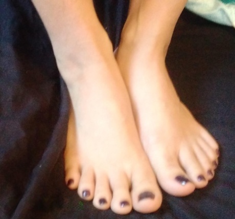 Asian chick Jasmine Jade sports black toenails while showing her hairless cunt
