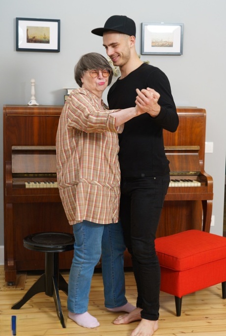 Overweight granny Sharon Amore has sexual intercourse with a young man