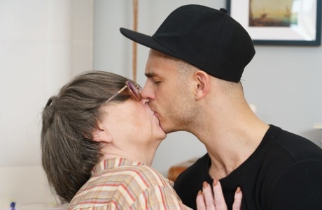Overweight granny Sharon Amore has sexual intercourse with a young man