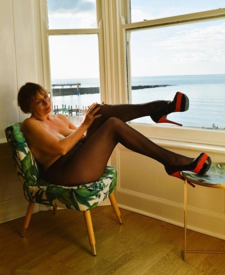 Older British lady Barby Slut goes topless at home before flashing in public