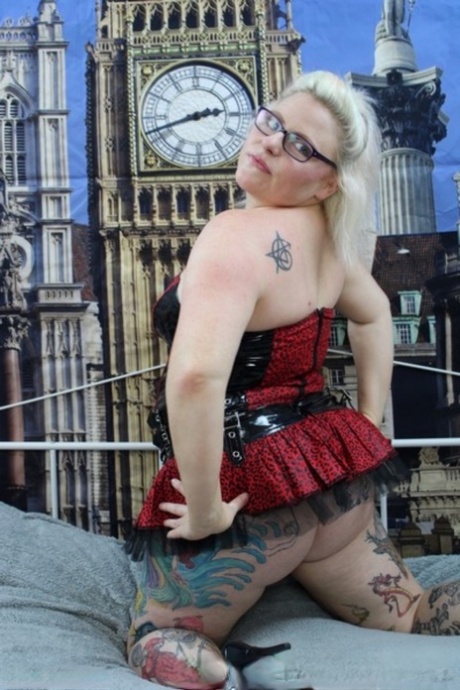 Overweight UK blonde Mollie Foxxx pops her boobs out of a dress in heels