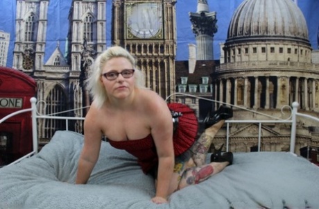 Overweight UK blonde Mollie Foxxx pops her boobs out of a dress in heels