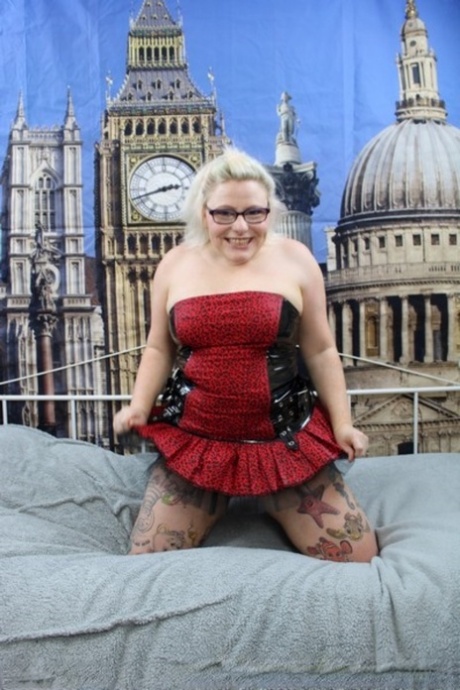 Overweight UK blonde Mollie Foxxx pops her boobs out of a dress in heels
