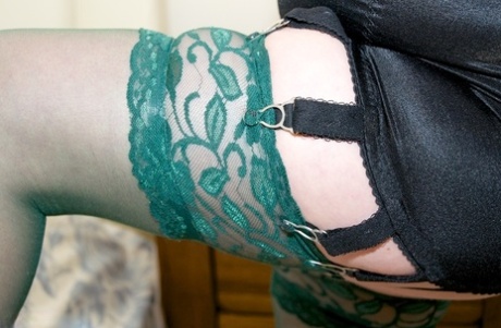 Older lady Dirty Doctor unveils her natural tits and bald pussy in sexy nylons