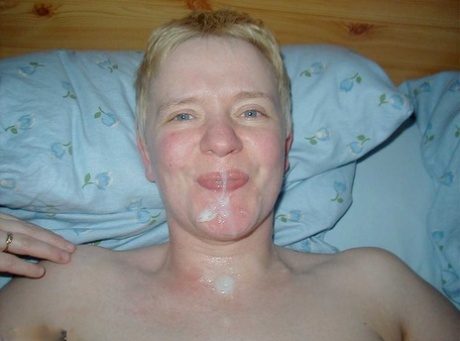 Older lady with short hair Tiffany Pearl wears a slave collar during kinky sex
